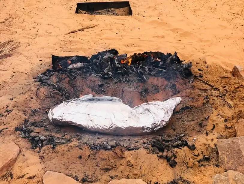 Tagella, a semolina flatbread baked in hot sand