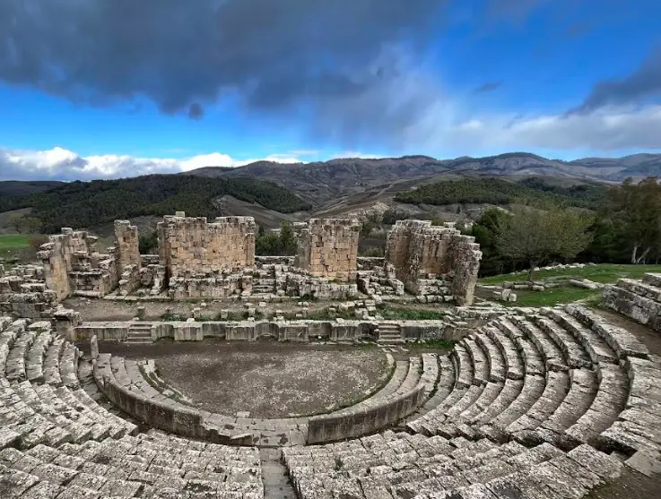 Ancient theatre of Djemila set in the mountain landscape